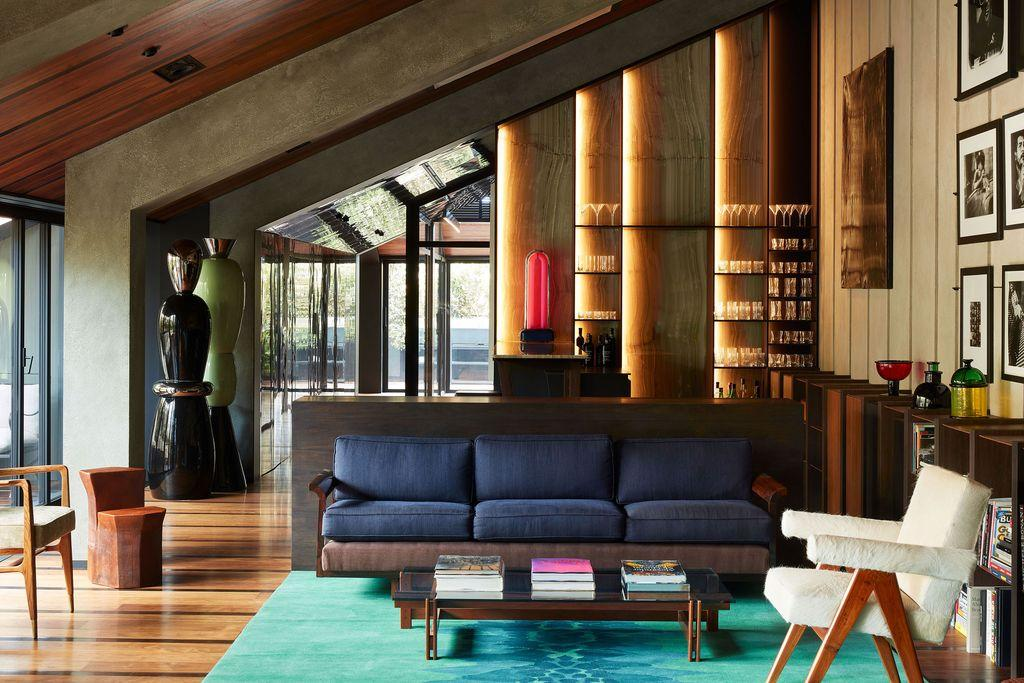 Living room in italian modern syle with sofa, arm chair and glass wall