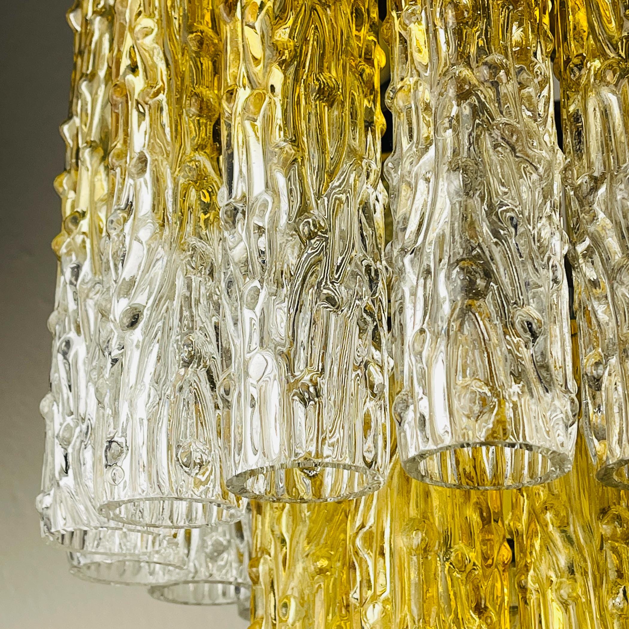 Close-up of a decorative chandelier with clear and gold glass elements.