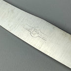 Close-up of a 800 silver vintage knife with a brand logo, made in Italy in 1960s
