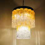 Chandelier with textured glass shades on a beige background