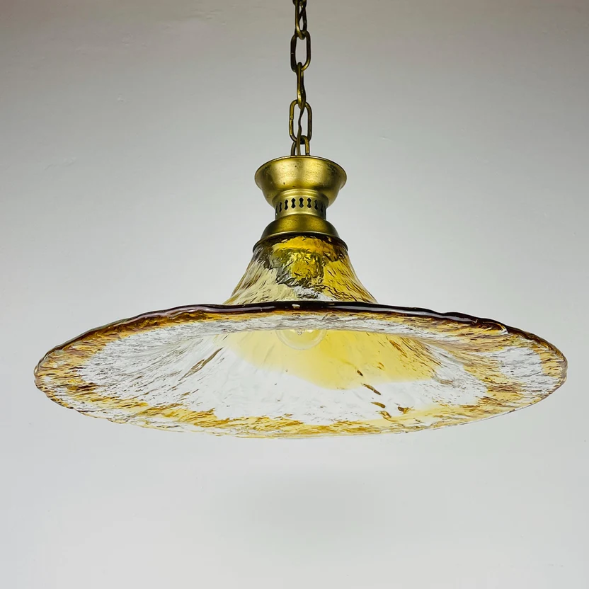 Vintage amber glass pendant light shade with a brass metal canopy and chain, from handmade glass by AV Mazzega, Italy.