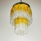 Chandelier with yellow and clear glass tubes on a white background