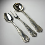 Vintage set of Italian 800 silver spoons and a fork on a gray background from 1960s